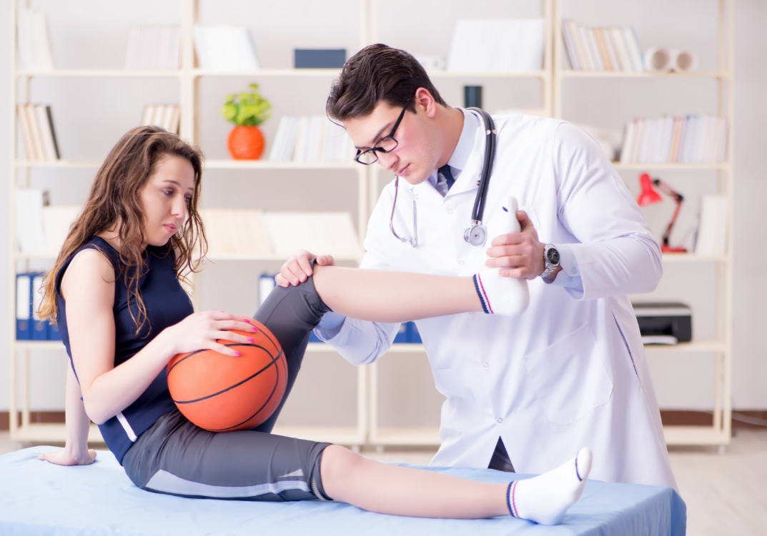 doctor performing sports physical
