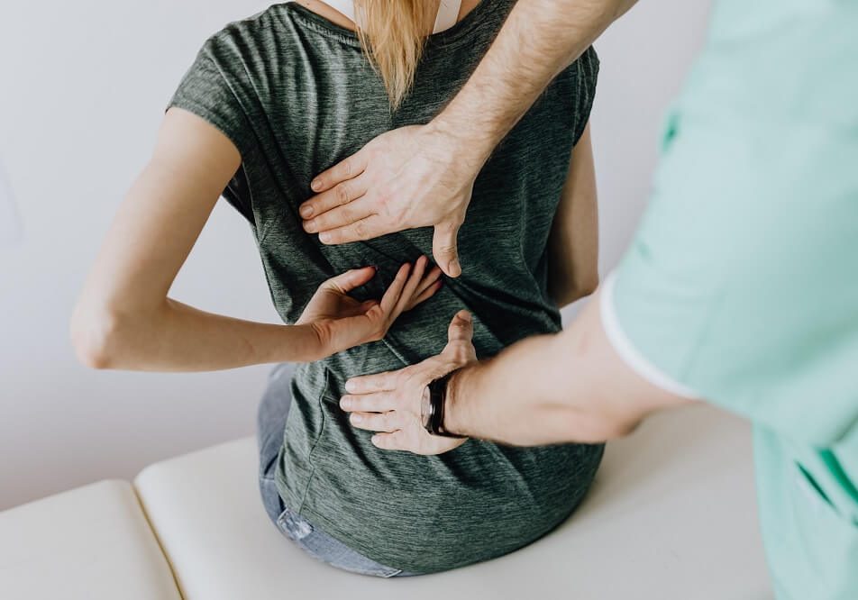 Palpation before a chiropractic adjustment